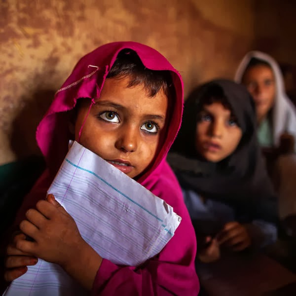 Girls attend lessons at a school in a slum on the outskirts of Islamabad.