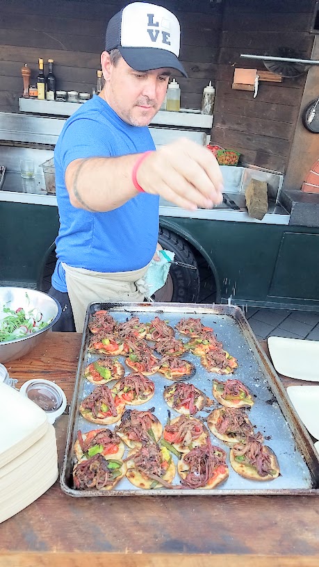 Red Hills Market created a Smoked Beef Brisket tostada with Mezcal flamed jalapenos, heirloom tomatoes, and cigar smoked avocados and radishes and micro cilantro for CigarBQue Portland 2016