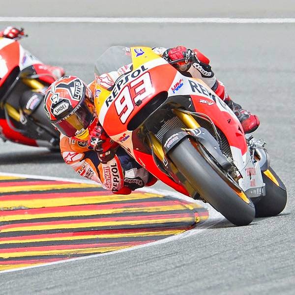 Honda rider Marc Marquez of Spain (R) competes to win ahead of Honda rider Dani Pedrosa of Spain in the MotoGP race of the Grand Prix of Germany at the Sachsenring Circuit, on July 13, 2014, in Hohenstein-Ernstthal, eastern Germany. 