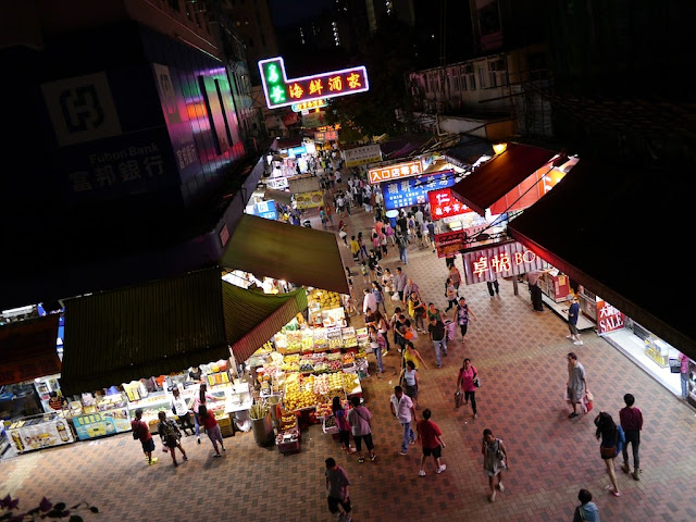 people at a pedestrian street shopping area in Tsuen Wan, Hong Kong