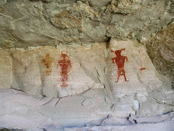 Four figures in Funk's Cave