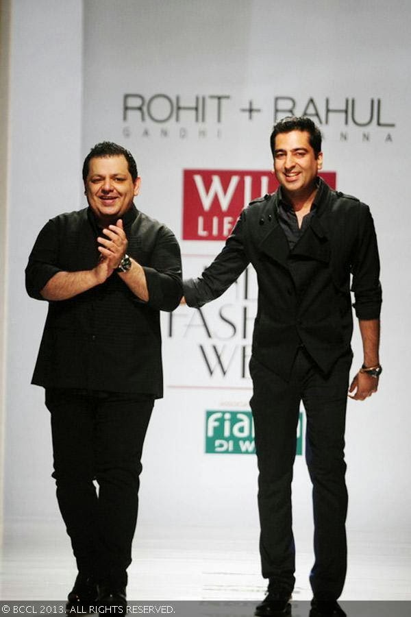 Designers Rohit Gandhi and Rahul Khanna walk the ramp for fashion after showcasing their creations on Day 3 of the Wills Lifestyle India Fashion Week (WIFW) Spring/Summer 2014, held in Delhi.