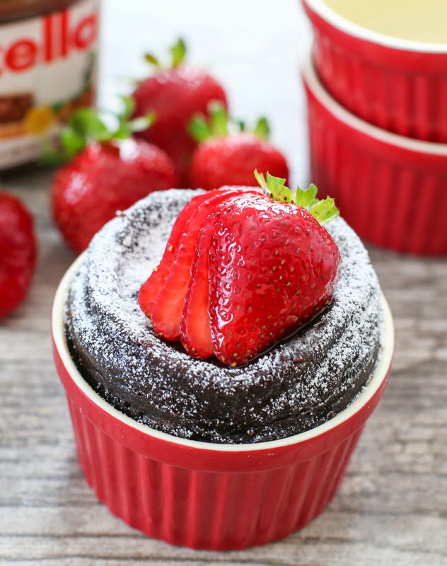 photo of a Flourless Nutella Mug Cake with fresh strawberries