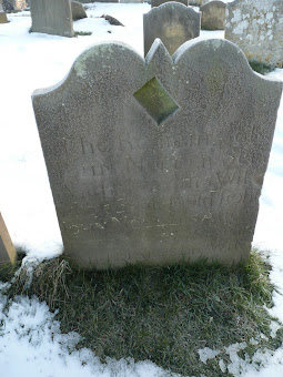 Gravestone showing the distinctive rectangular sundial