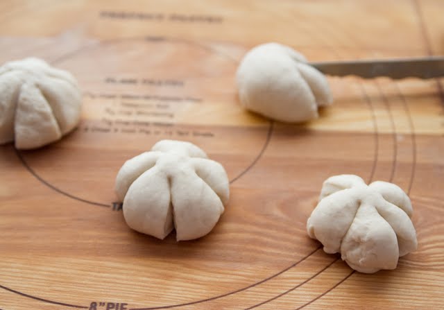 photo of the dough balls cut to resemble pumpkins