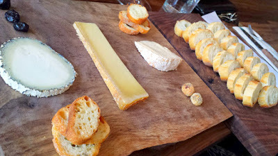 A cheese board at Chizu that includes Veigadarte, a goat cheese from Spain; Beaufort D'été, a raw cow cheese from France; Cowgirl Creamery's Red Hawk cow cheese from California