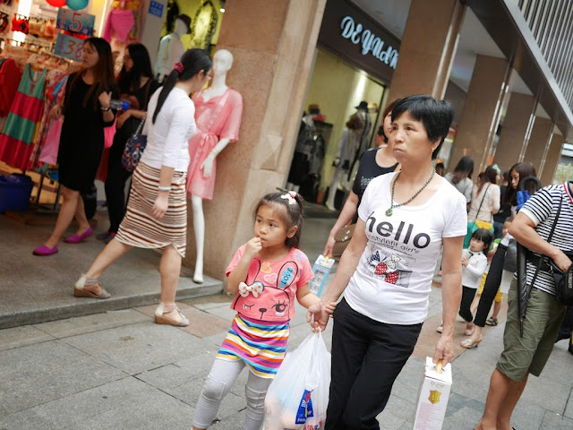 woman wearing a shirt with "hello" on it