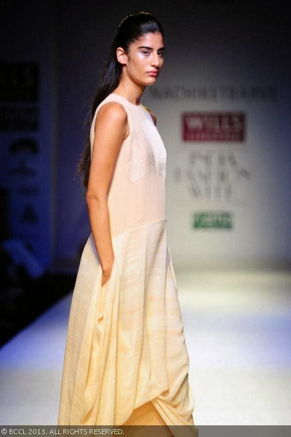 Erika showcases a creation by fashion designer Nachiket Barve on Day 1 of Wills Lifestyle India Fashion Week (WIFW) Spring/Summer 2014, held in Delhi.