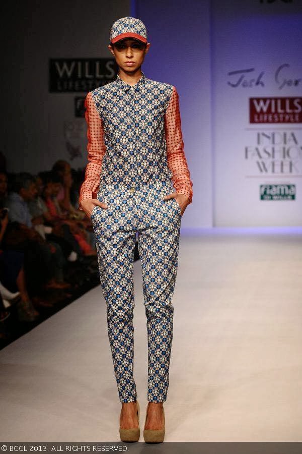 Sapna showcases a creation by fashion designer Josh Goraya on Day 5 of Wills Lifestyle India Fashion Week (WIFW) Spring/Summer 2014, held in Delhi.