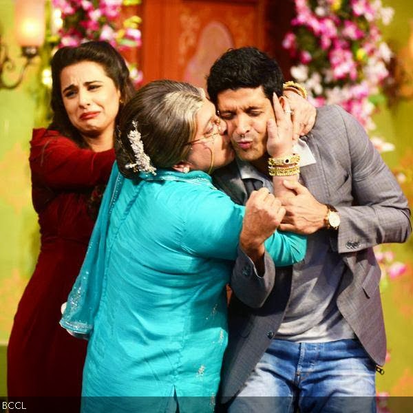 Farhan receives Shagun Ki Pappi from Dadi played by Ali Asgar while Vidya looks on helplessly during the promotion of the movie Shaadi Ke Side Effects, on the sets of the TV show Comedy Nights With Kapil. 