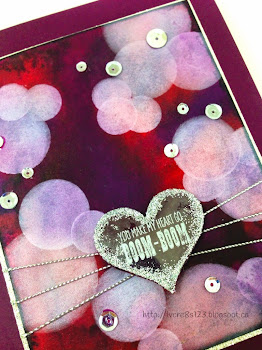 Linda Vich Creates: Valentine Round Up. A sequin-studded, jewel-toned watercolor bokeh background is embellished with a valentine heart strung on silver cords.