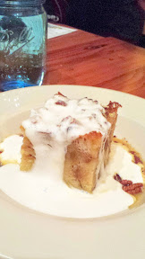 Acadia Restaurant dessert of Vanilla Bean Bread Pudding with white-chocolate brandy ganache, thickened sweet cream poured dramatically tableside