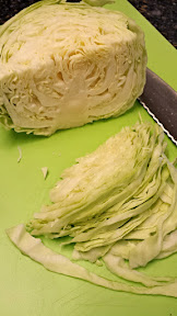 Slicing cabbage into shreds for a Cauliflower colcannon recipe