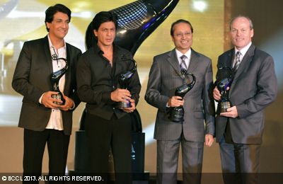 (L-R) Shiamak Davar, Shah Rukh Khan, Vineet Jain, MD Times Group and Jim Nickel, Acting Consul General and Deputy High Commissioner of Canada pose together at the unveiling of 'Times of India Film Awards' trophy, held in Mumbai on January 29, 2013.