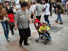 older couple with child in a stroller