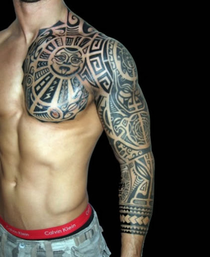 [Image: tribal-rock-styled-tattoo-on-arm-and-chest.jpg]