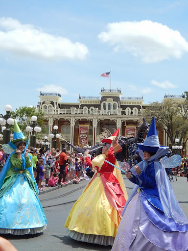New Disney World Parade: Festival of Fantasy. Flora, Fauna, and Merryweather appear to float by. 