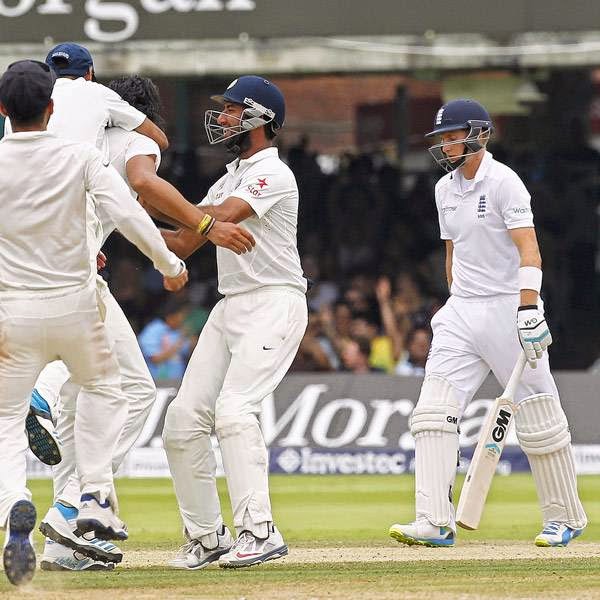 India's Ishant Sharma (3rd L) celebrates taking the wicket of England's Joe Root (2nd R) for 66 runs on the fifth day of the second cricket Test match between England and India at Lord's cricket ground in London on July 21, 2014.