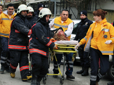 An Associated Press journalist saw a body in the street in front of an embassy side entrance. The bomb appeared to have exploded inside the security checkpoint at the entrance of the visa section of the embassy. Several ambulances were dispatched to the area. An AP journalist saw at least one woman who appeared to be seriously injured being carried into an ambulance.