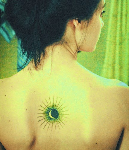 sun tattoo on the back