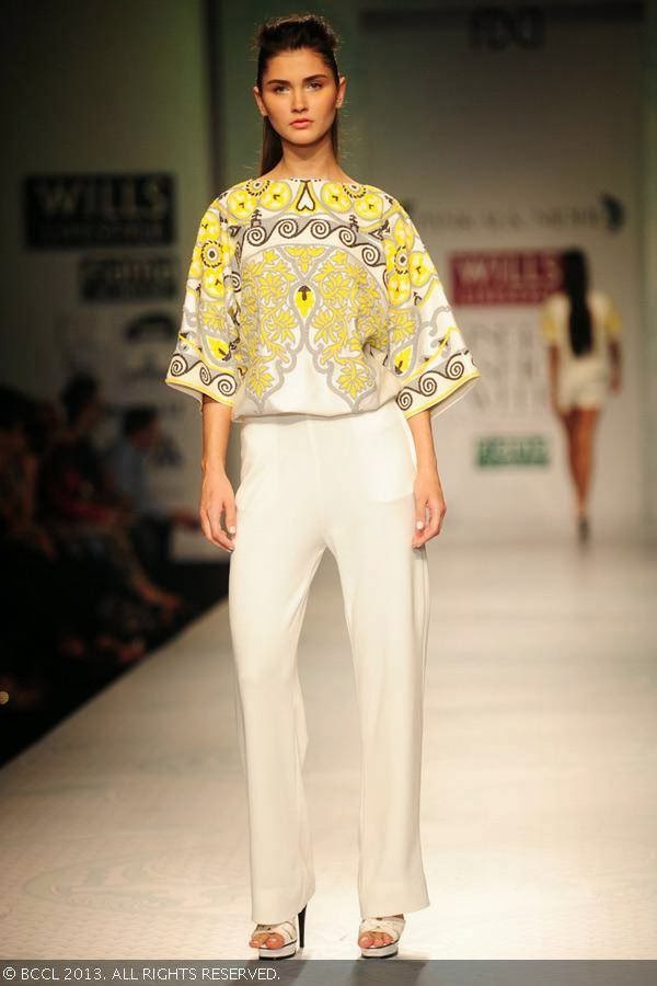A model showcases a creation by designer duo Pankaj and Nidhi on Day 2 of the Wills Lifestyle India Fashion Week (WIFW) Spring/Summer 2014, held in Delhi.