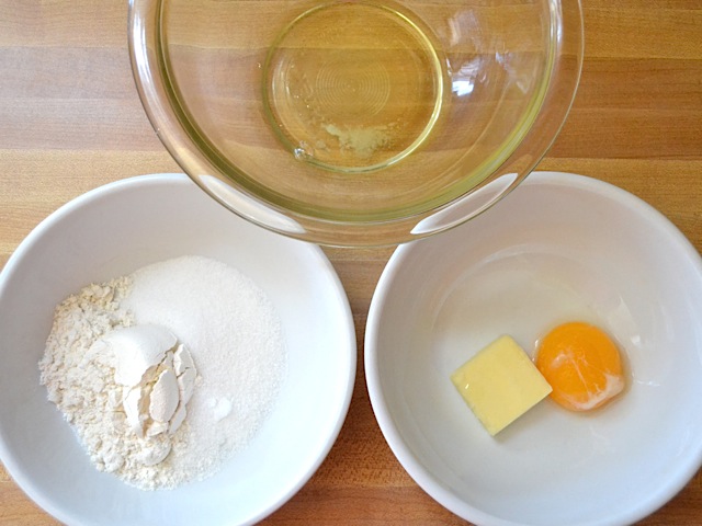 three bowls (dry ingredients, butter and egg yolks, egg white)