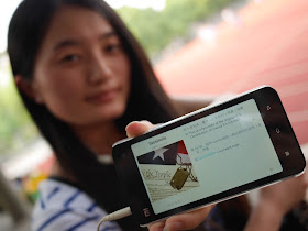 student showing a Xiaomi smartphone displaying the page for "facsimile" in an English language learning app.