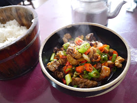 spicy chicken dish, rich, and a pot of tea at a restaurant in Changsha, China