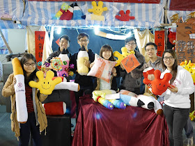 seven college students holding stuffed toys