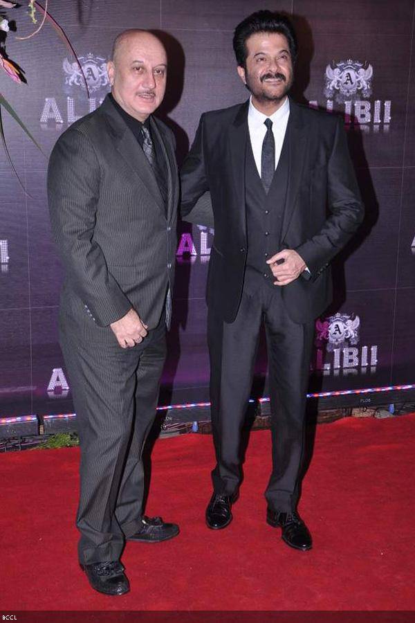 Anupam Kher with Anil Kapoor pose for the shutterbugs during Bollywood actress Sridevi's birthday party, held in Mumbai, on August 17, 2013. (Pic: Viral Bhayani)