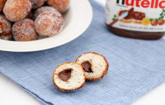 photo of a donut hole sliced in half to show the nutella filling