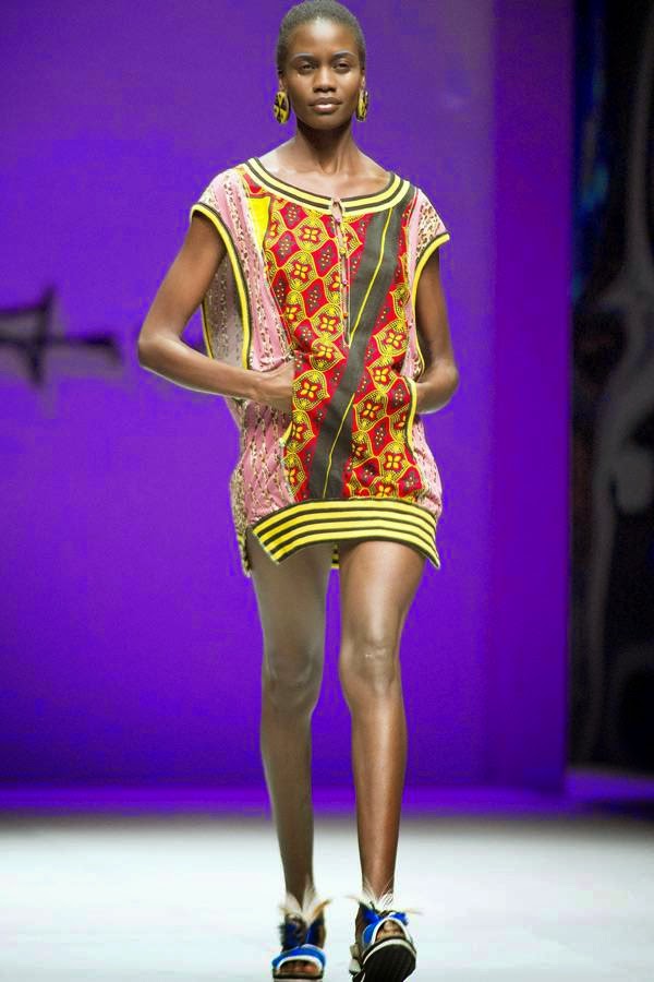 A model presents a creation by South African fashion designer Marianne Fassler on July 24, 2014 during the fashion week at the Cape Town International Convention Centre, in Cape Town, South Africa.