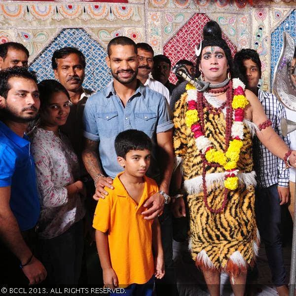 Cricketer Shikhar Dhawan at a Ram Leela in north Delhi. Ram Leela committee members claimed Dhawan has grown up as a child in this part of the city and therefore promptly accepted the invitation to attend the event.