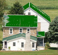Green tint on metal roof over stone house