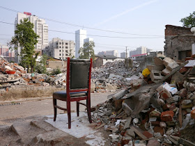 a chair sitting next to rubble near Beizheng Street in Changsha