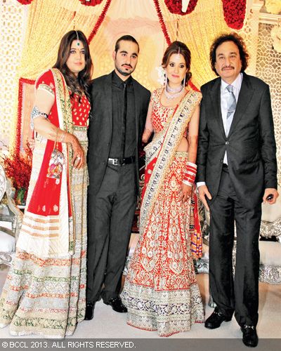 Arjun Hitkari and Gayatri pose with Debbie(L) and Arun (R) during their sangeet ceremony, held in Hyderabad recently.