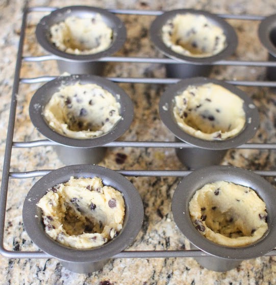  the cookie dough pressed into the baking molds