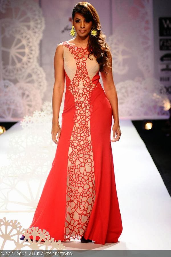 Bollywood actress Mugdha Godse walks the ramp for fashion designer duo Paras and Shalini on Day 1 of the Wills Lifestyle India Fashion Week (WIFW) Spring/Summer 2014, held in Delhi.