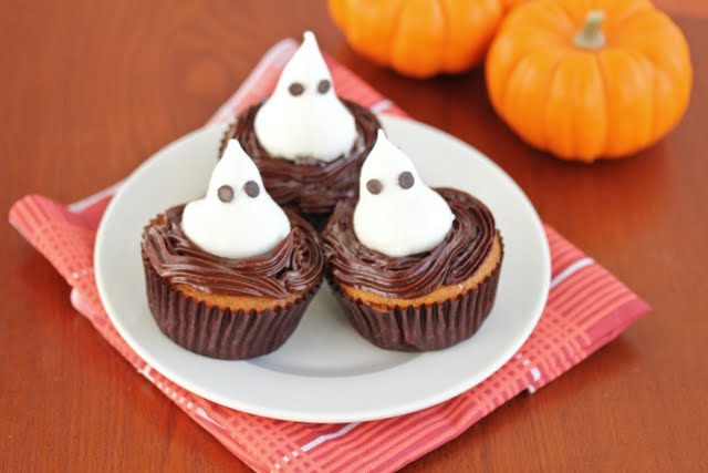 photo of three ghost cupcakes on a plate