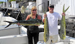 Donna and Mike Ferrera visiting from Scottsdale, AZ showing off their three nice Mahi Mahi on October 16, 2011