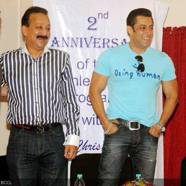 Baba Siddiqui and Salman Khan share a smile during a charity event, held at Holy Family Hospital, in Mumbai, on October 11, 2013. (Pic: Viral Bhayani)