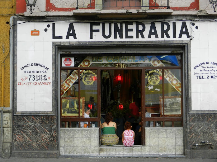 Waiting for water and ice at the Funeral Store (coffin makers)