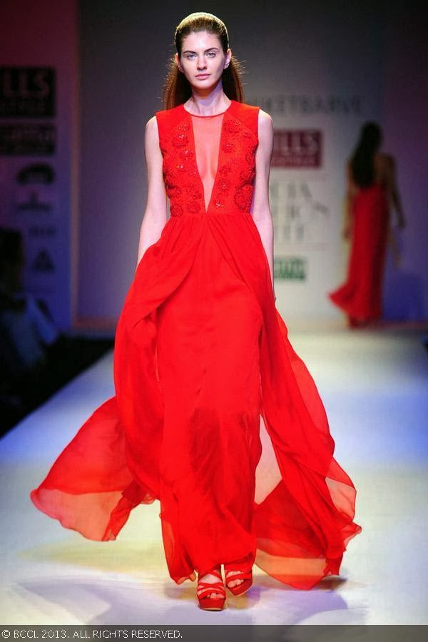 Olga showcases a creation by fashion designer Nachiket Barve on Day 1 of Wills Lifestyle India Fashion Week (WIFW) Spring/Summer 2014, held in Delhi.