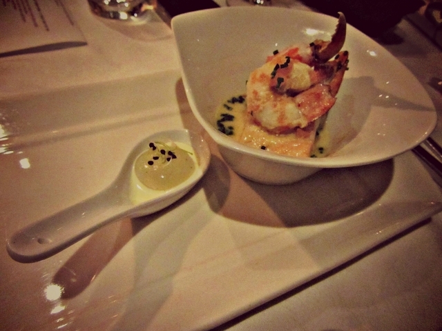 A light Seafood Stew of Scottish Salmon and Prawn steamed in a Fish Cream 