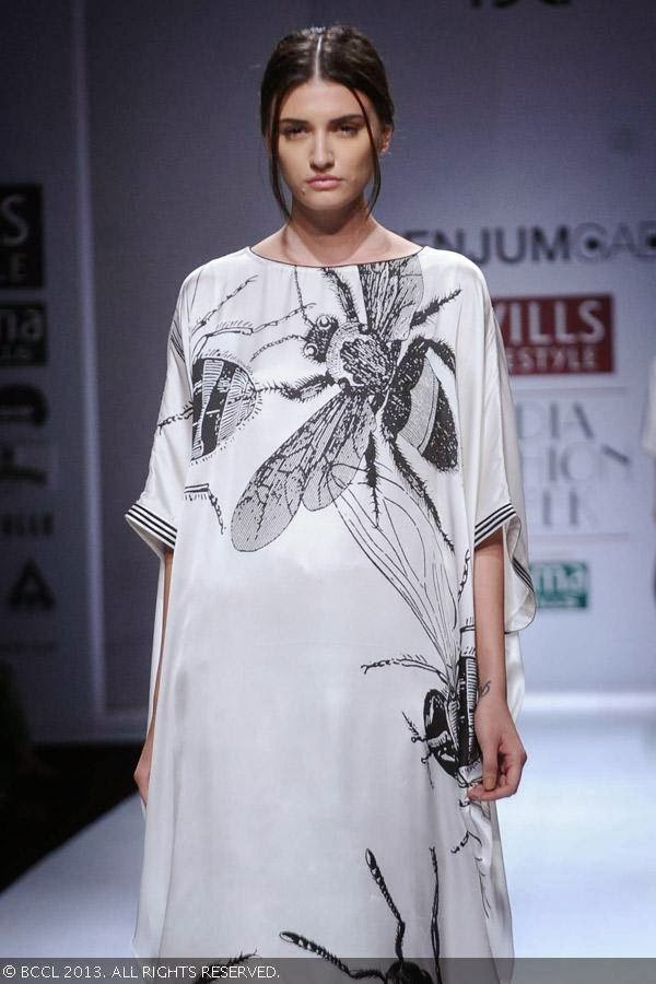 Marii showcases a creation by fashion designer Jenjum Gadi on Day 3 of Wills Lifestyle India Fashion Week (WIFW) Spring/Summer 2014, held in Delhi.