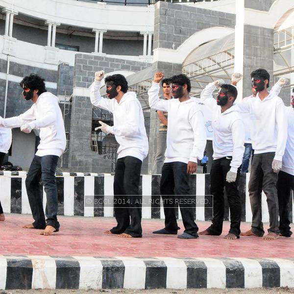 Students of Barton Hill College performing a mime at Thampanoor Junction to spread traffic and medical awareness among people. 