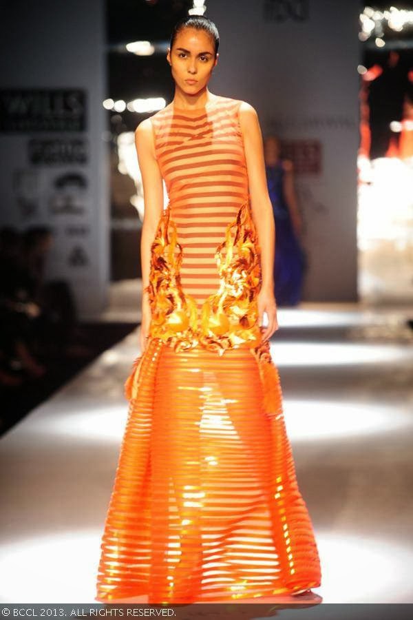 A model showcases a creation by fashion designer Amit Aggarwal on Day 2 of Wills Lifestyle India Fashion Week (WIFW) Spring/Summer 2014, held in Delhi.