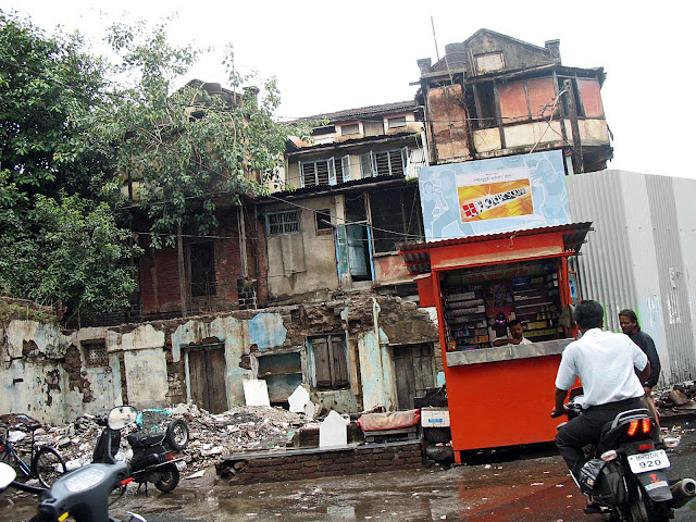 demolished building standing near kiosk