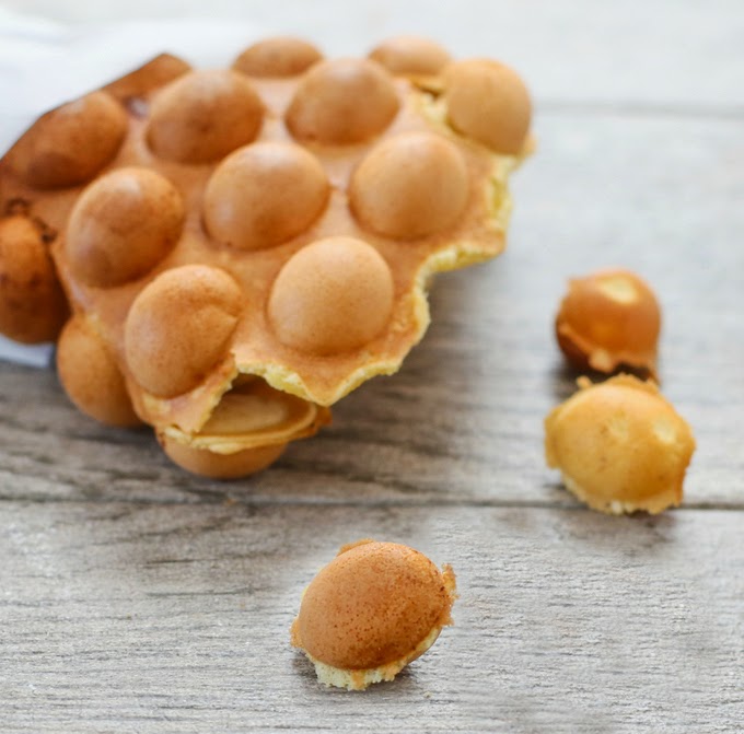 a close-up of Hong Kong egg waffle with a few pieces broken off