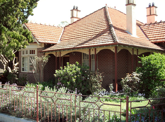 This verandah has an ornamental timber valance beneath the rafters, in a naturalistic style